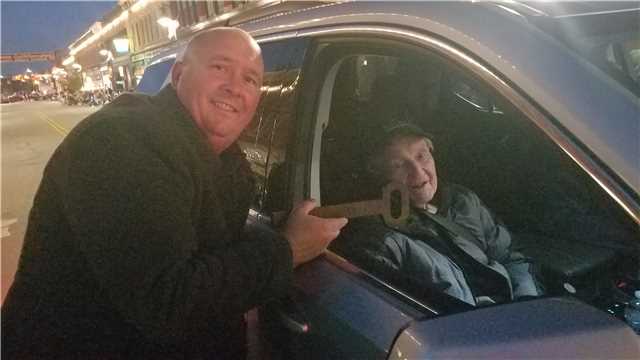2025 Grand Marshal Norm Steury receives the key to the City from Mayor Dan Rickord